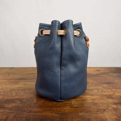 LEATHER BUCKET BAG - MEDIUM - SMOKEY BLUE - NATURAL STRAPS - WATER DAMAGE IN SHIPMENT - NEARLY PERFECT - IN STOCK