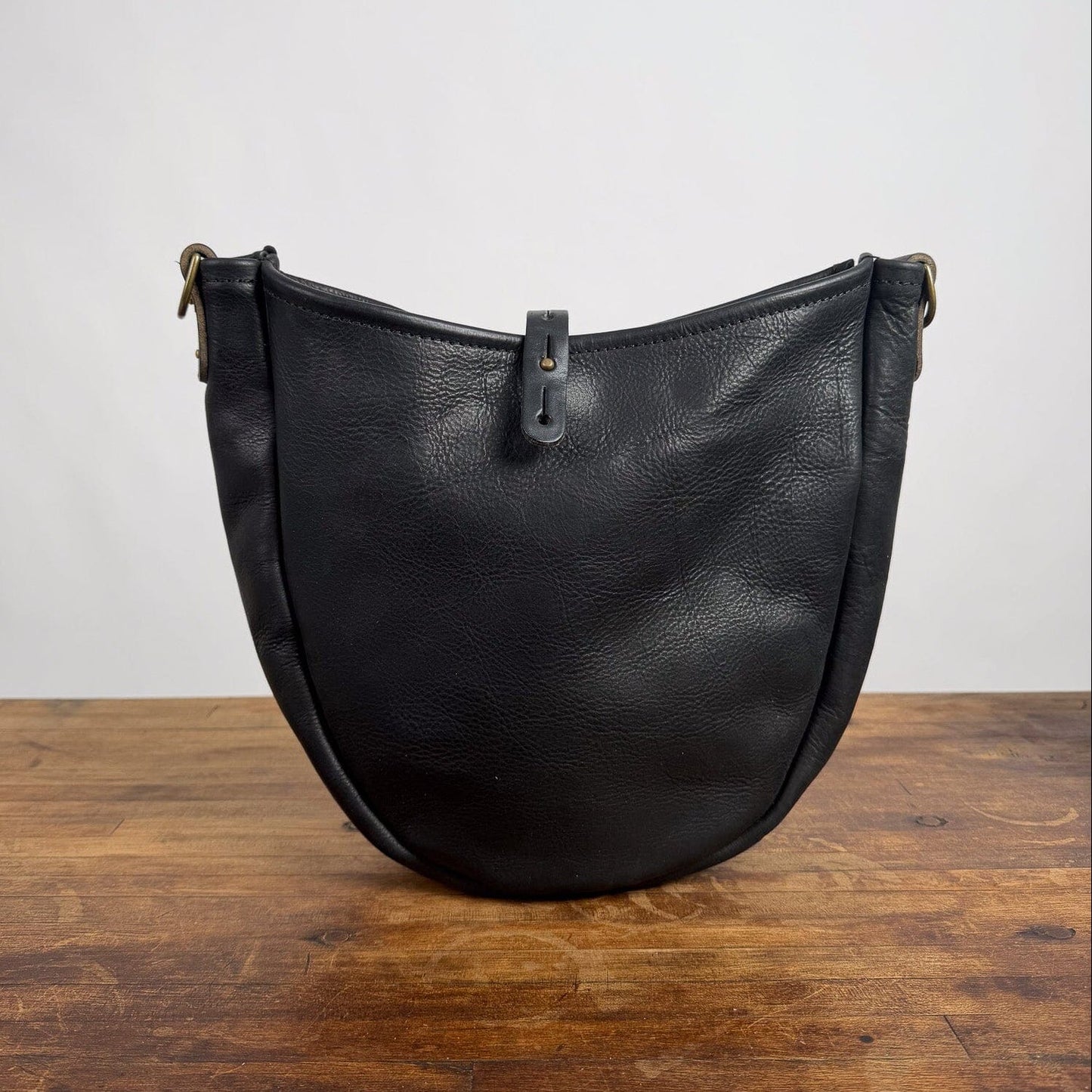 CELESTE LEATHER HOBO BAG - BLACK BISON - BUTTON STUD IS NOT ALIGNED - NEARLY PERFECT - IN STOCK